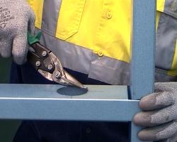Hand cutting light gauge steel with tin snips